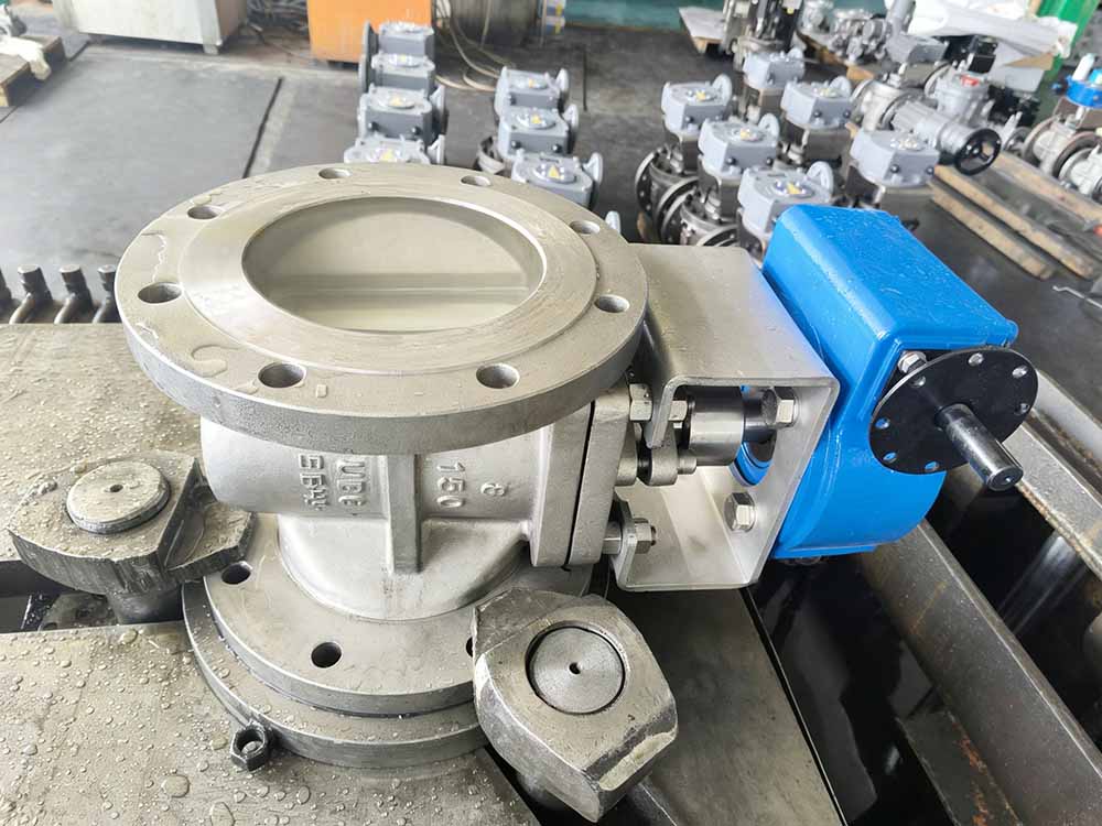 Side view of a flanged plug valve in a manufacturing workshop environment.