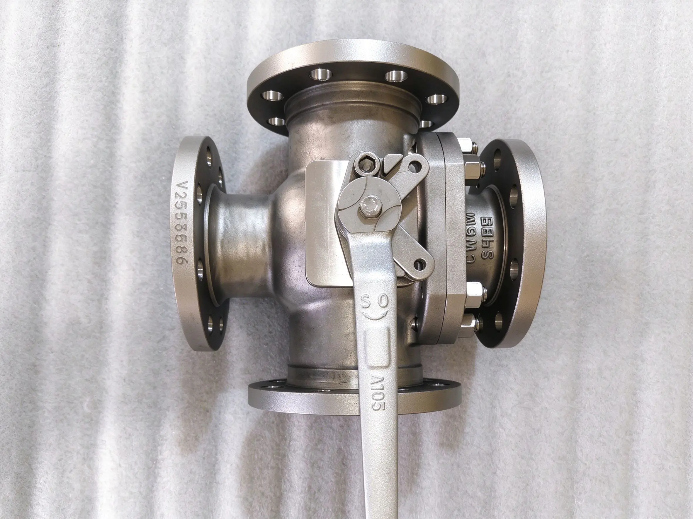 Four-way ball valve side view with lever handle operation